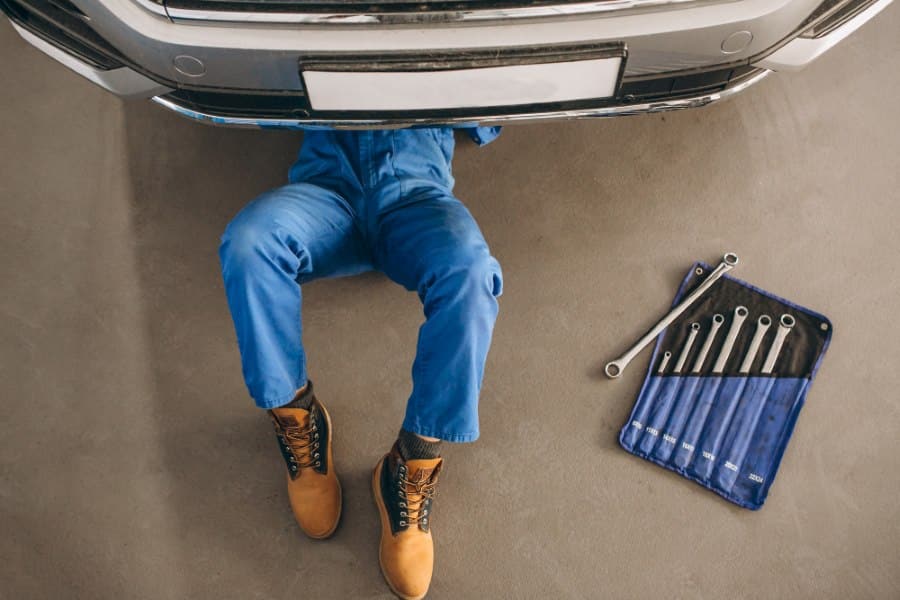mechanic under vehicle